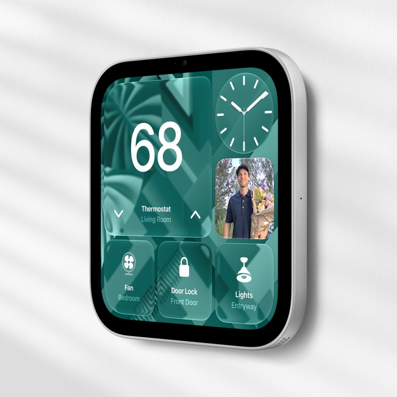 Silver wall-mounted HomeView displaying a thermostat, door camera and smart home controls.